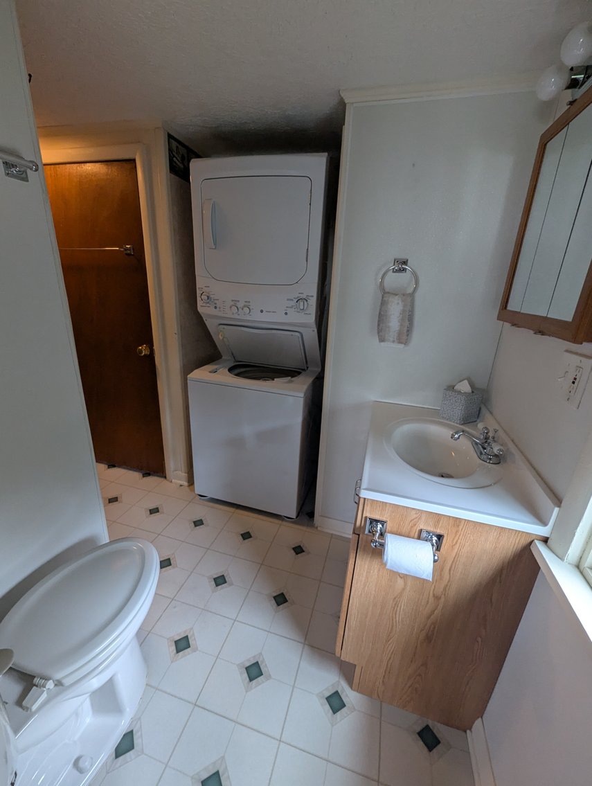 Image for LARGE WATERFRONT PROPERTY/ 2-STORY CONTEMP. HOME W/ ATT. 2-CAR GARAGE & 1-BR COTTAGE HOME/(4) PARCELS TOTALING 3.35 +/- AC SOLD IN THE ENTIRETY/ 155' FT FRONTAGE ON BUSH RIVER W SANDY BEACH/ LARGE DOCK W/ (10) +/- BOAT SLIPS, TIKI BAR & MORE!