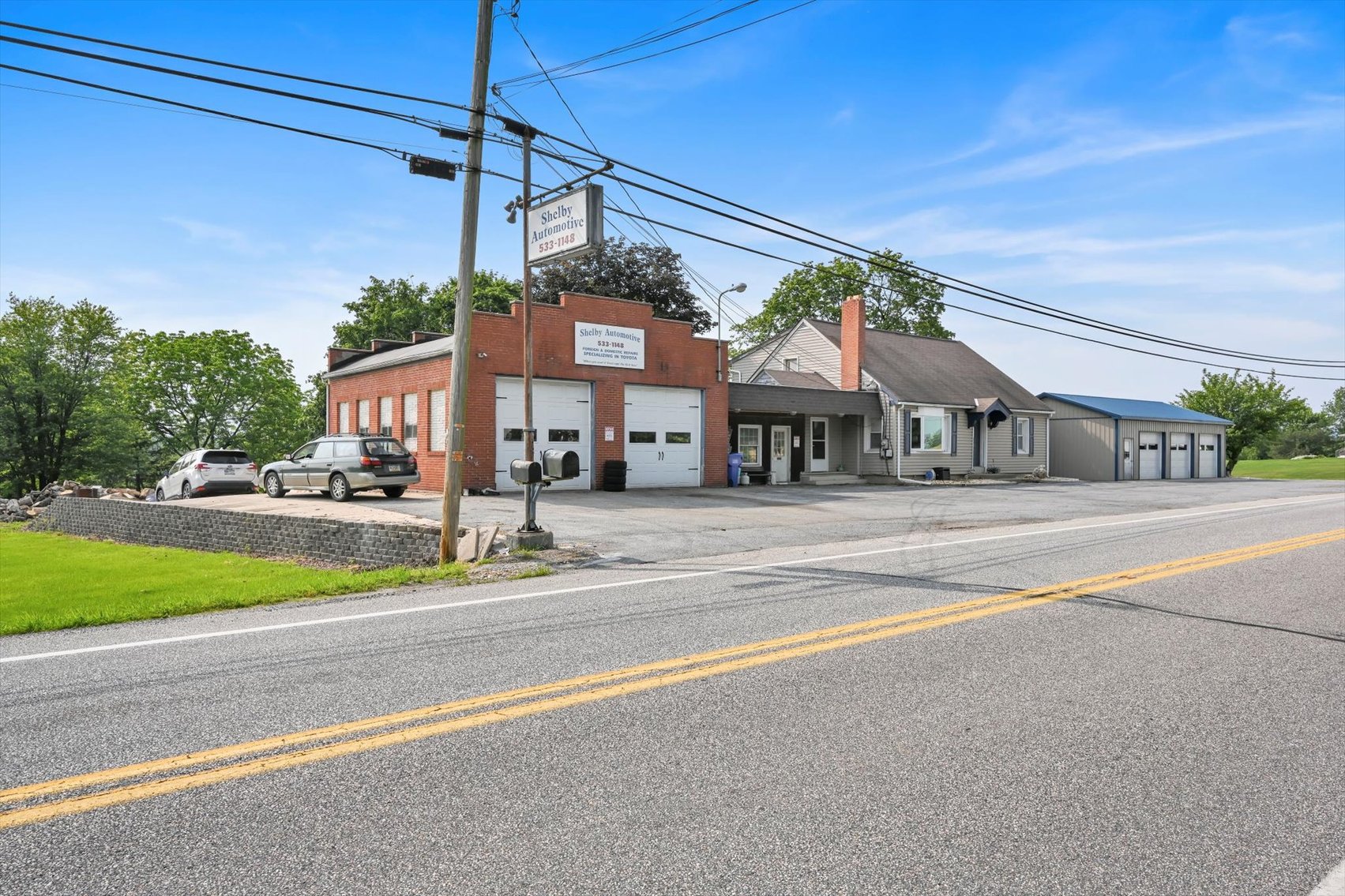 Image for Online Real Estate Auction - Cape Cod Style House with Auto Body Garage on 2+ Acres
