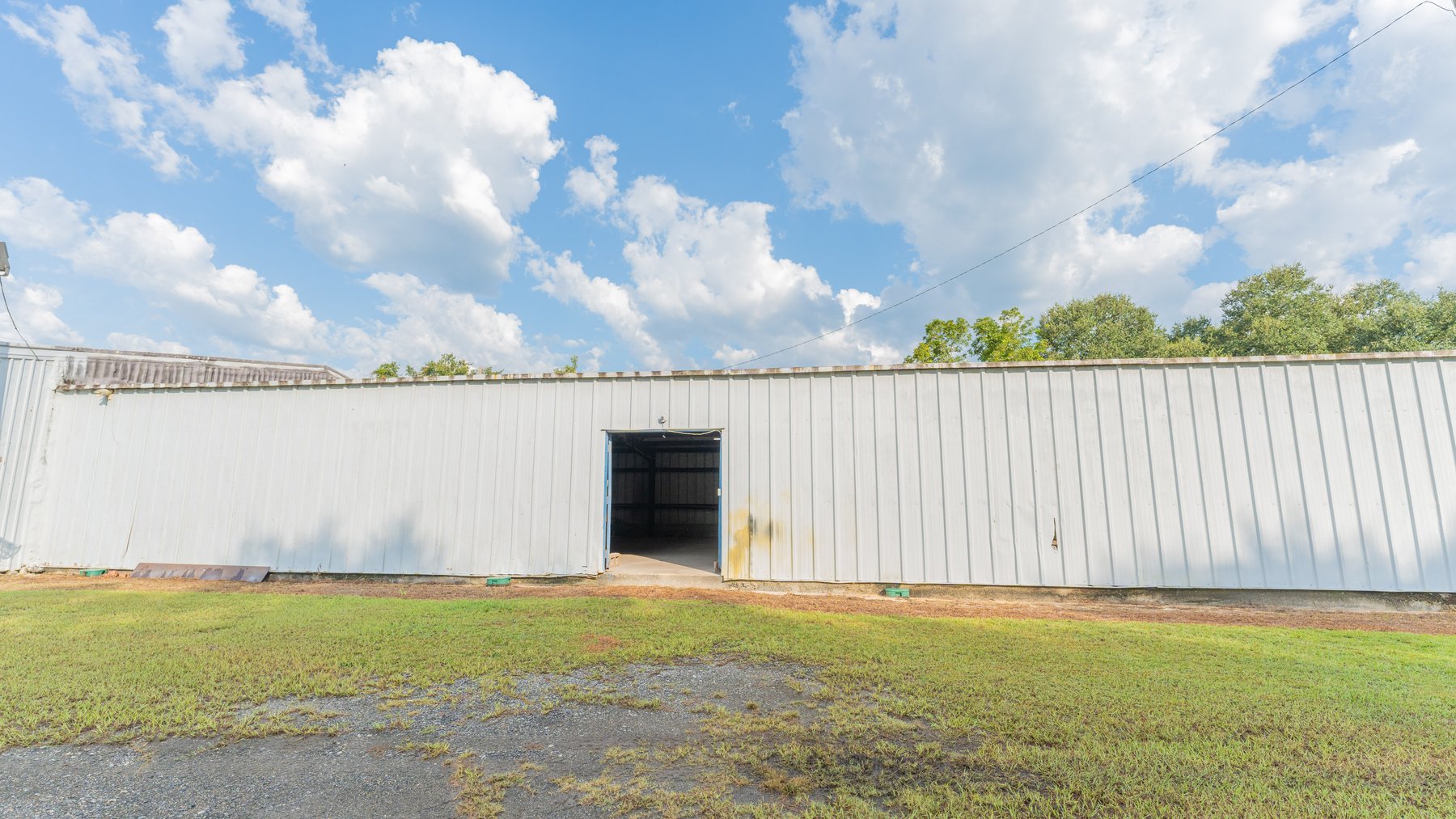 Image for 1.98+/- Acre Commercial Property with Versatile 4,887+/- Sq Ft Shop with Office and 1000+/- Sq Ft Open-Air Barn