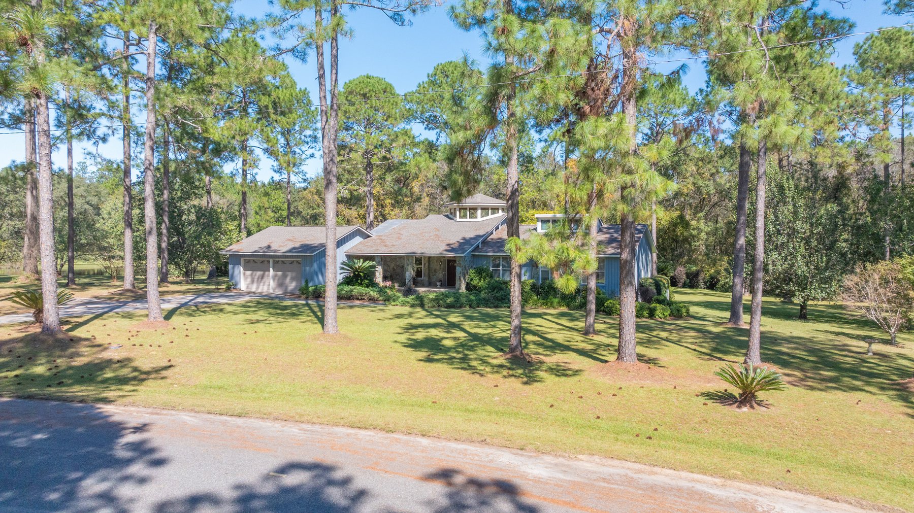 Image for Carolyn A. Peace Living Estate - Beautiful Stone-Faced Wood-Siding Ranch-Style Home