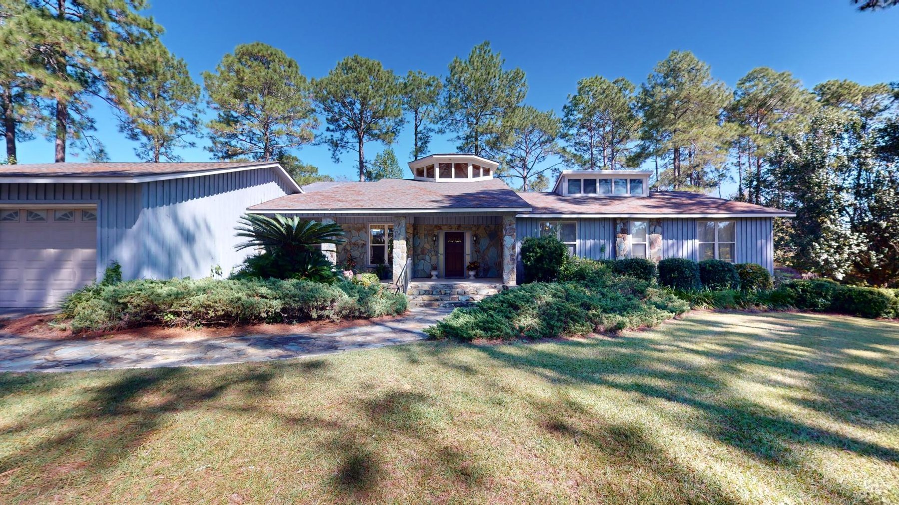 Image for Carolyn A. Peace Living Estate - Beautiful Stone-Faced Wood-Siding Ranch-Style Home