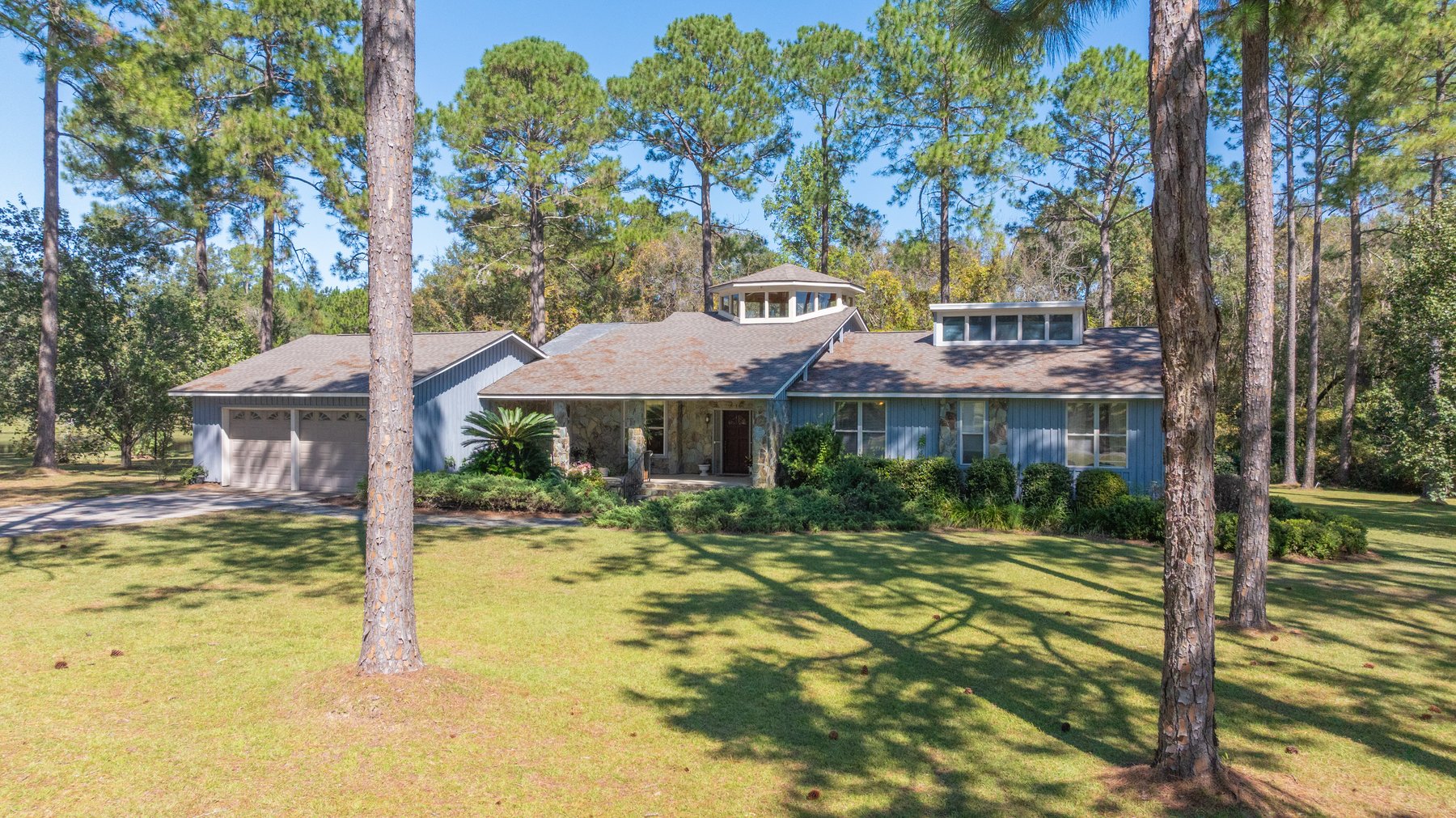 Image for Carolyn A. Peace Living Estate - Beautiful Stone-Faced Wood-Siding Ranch-Style Home