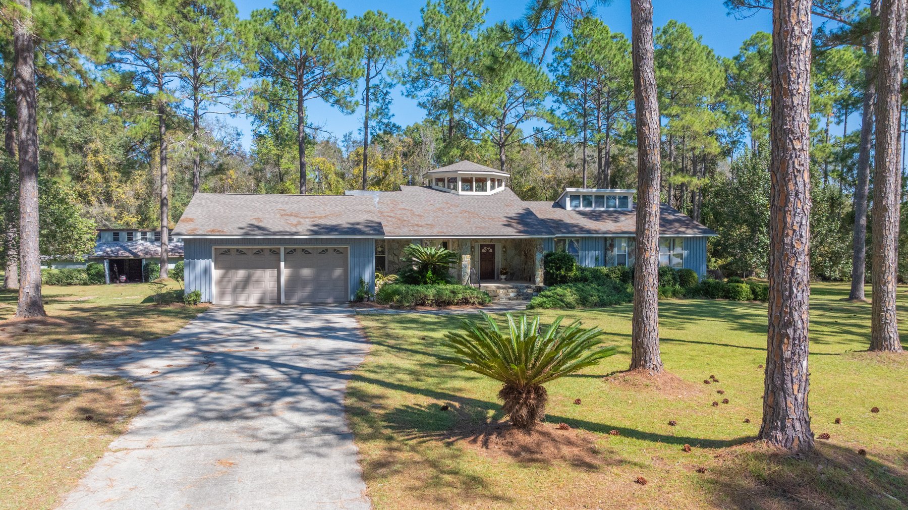 Image for Carolyn A. Peace Living Estate - Beautiful Stone-Faced Wood-Siding Ranch-Style Home
