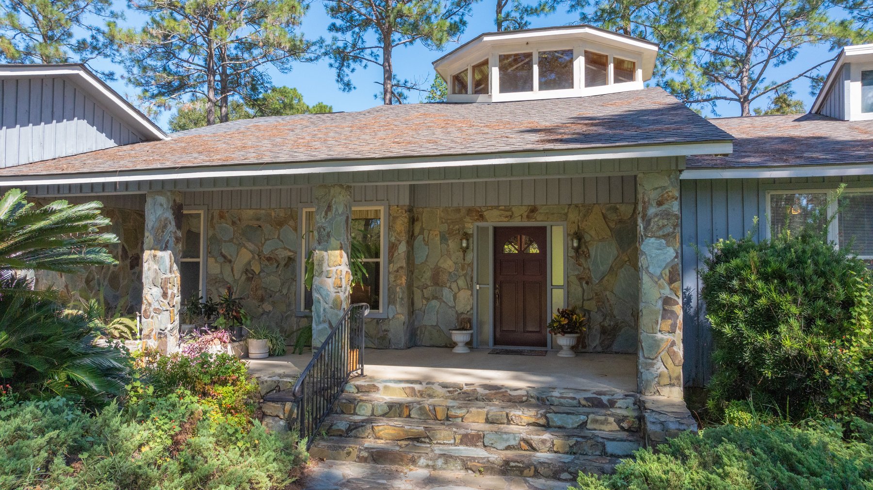 Image for Carolyn A. Peace Living Estate - Beautiful Stone-Faced Wood-Siding Ranch-Style Home