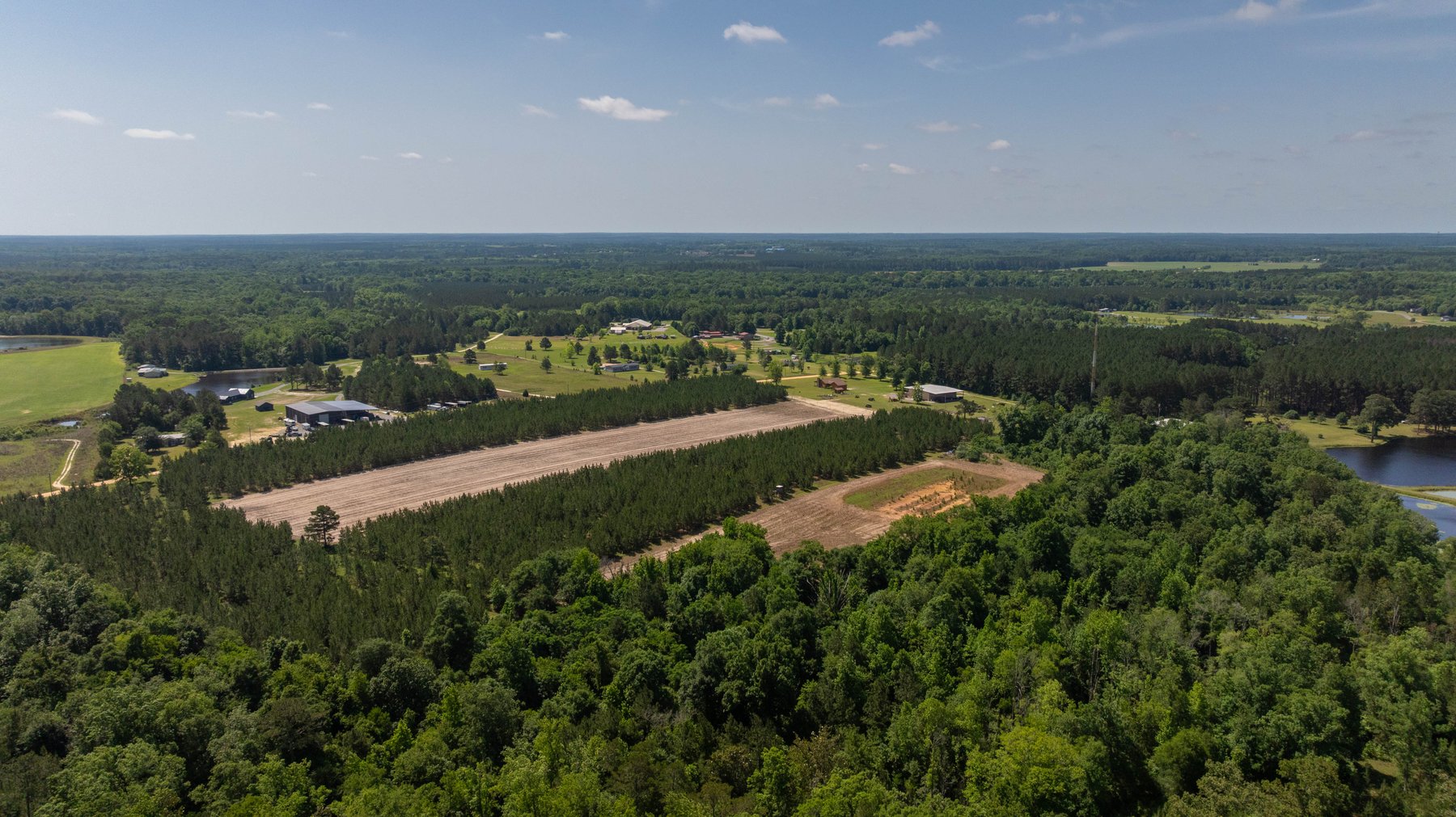 Image for 176+/- Acres - 6,546+/- SF Custom Lodge w/ Stocked Ponds & Food Plots - Mature Timber & Rocky Creek Frontage