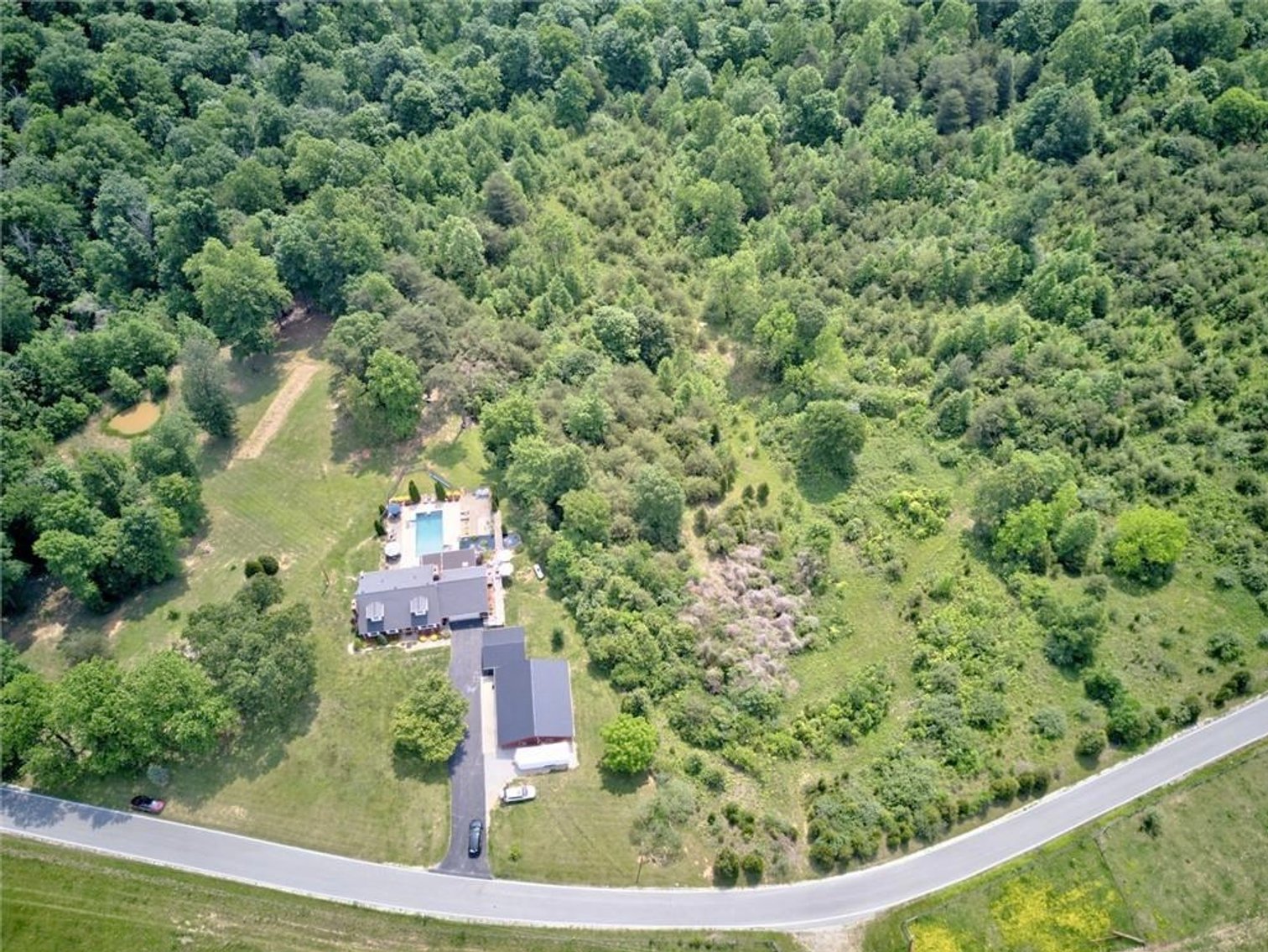 Image for Harrison County Real Estate Auction,  Cape Cod on 9.87 Acres, Inground Pool, Koi Pond & Finished Walkout - ONLINE AUCTION ONLY