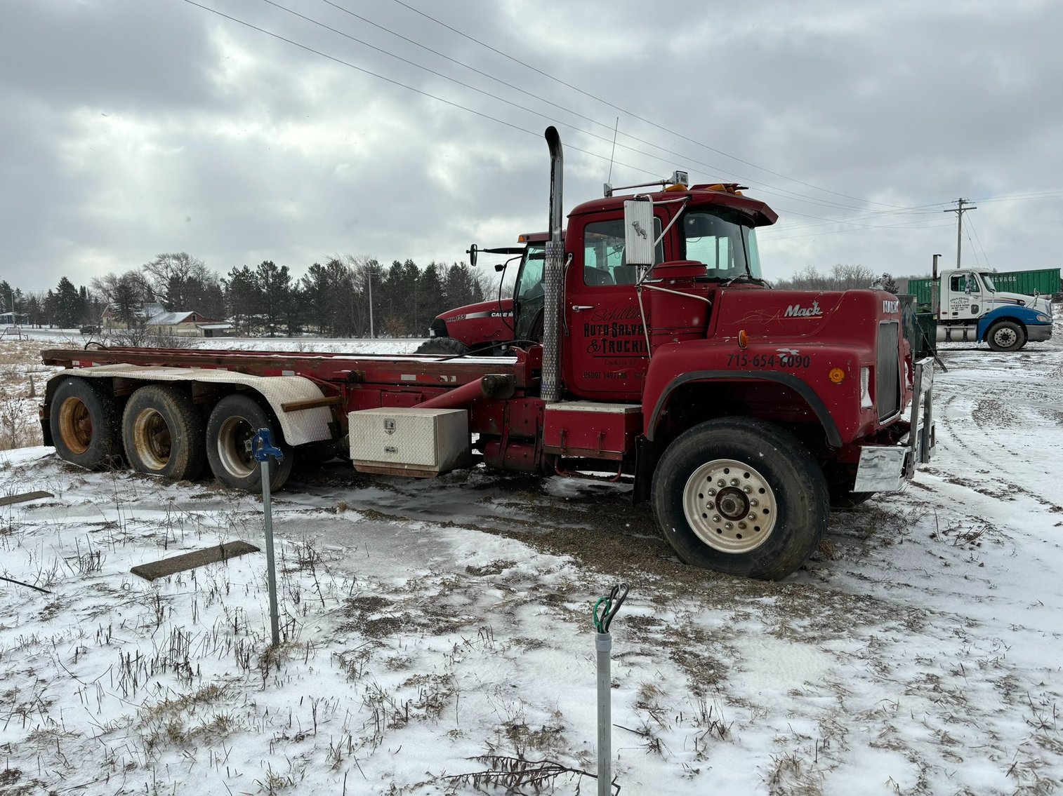 1987 Mack Cable Roll off Truck & Case 95XT Skid Loader