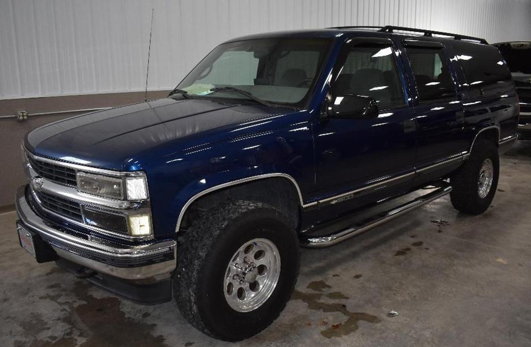 (2) Service Trucks, (2) Suburbans, and Exercise Equipment