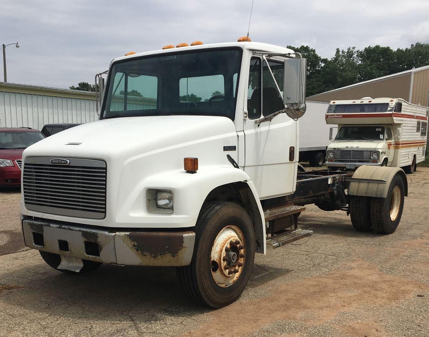 Early July Truck Auction: Dock Trucks, Cargo Vans, 2005 Flatbed Trailer