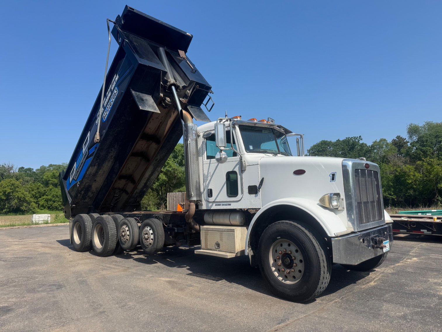 Heavy Equipment Auction: Peterbilt Dump Trucks, Racking, Attachments & More (141937)